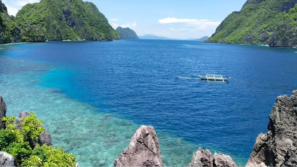 Scenic view of turquoise waters and limestone cliffs in Coron, Palawan.