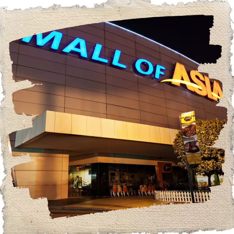 Exterior view of SM Mall of Asia in Manila at night, with its bright signage and modern architecture.