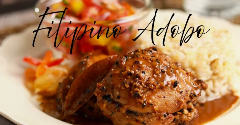 Filipino chicken adobo with rice and tomato mango salad on a plate.