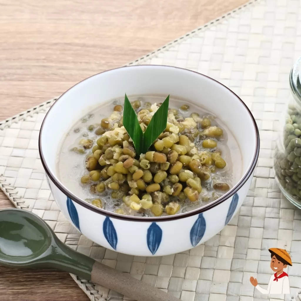 Sauteed monggo in served in a white bowl with pandan leaf garnish