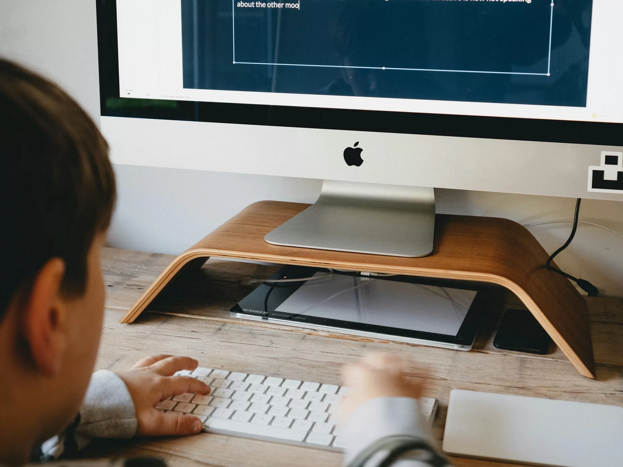 Boy homeschooling using a desktop computer