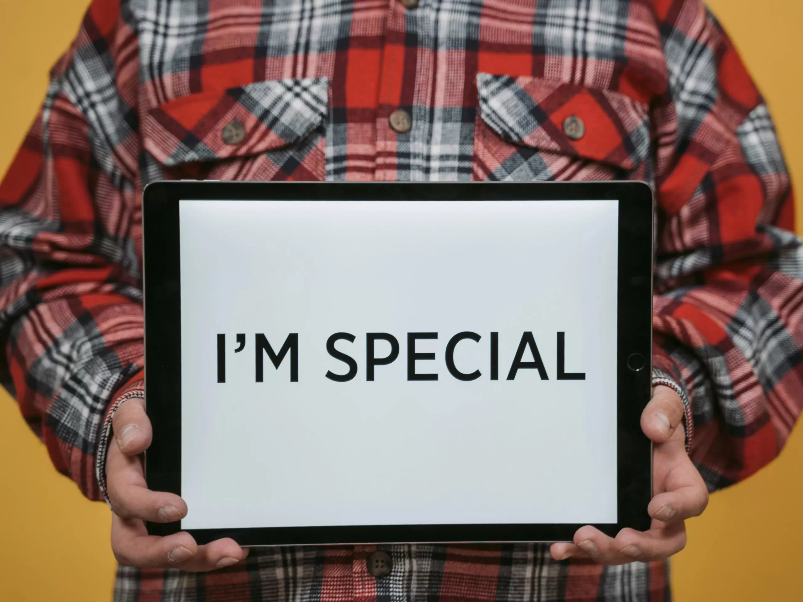 A tablet screen displaying "I am special"