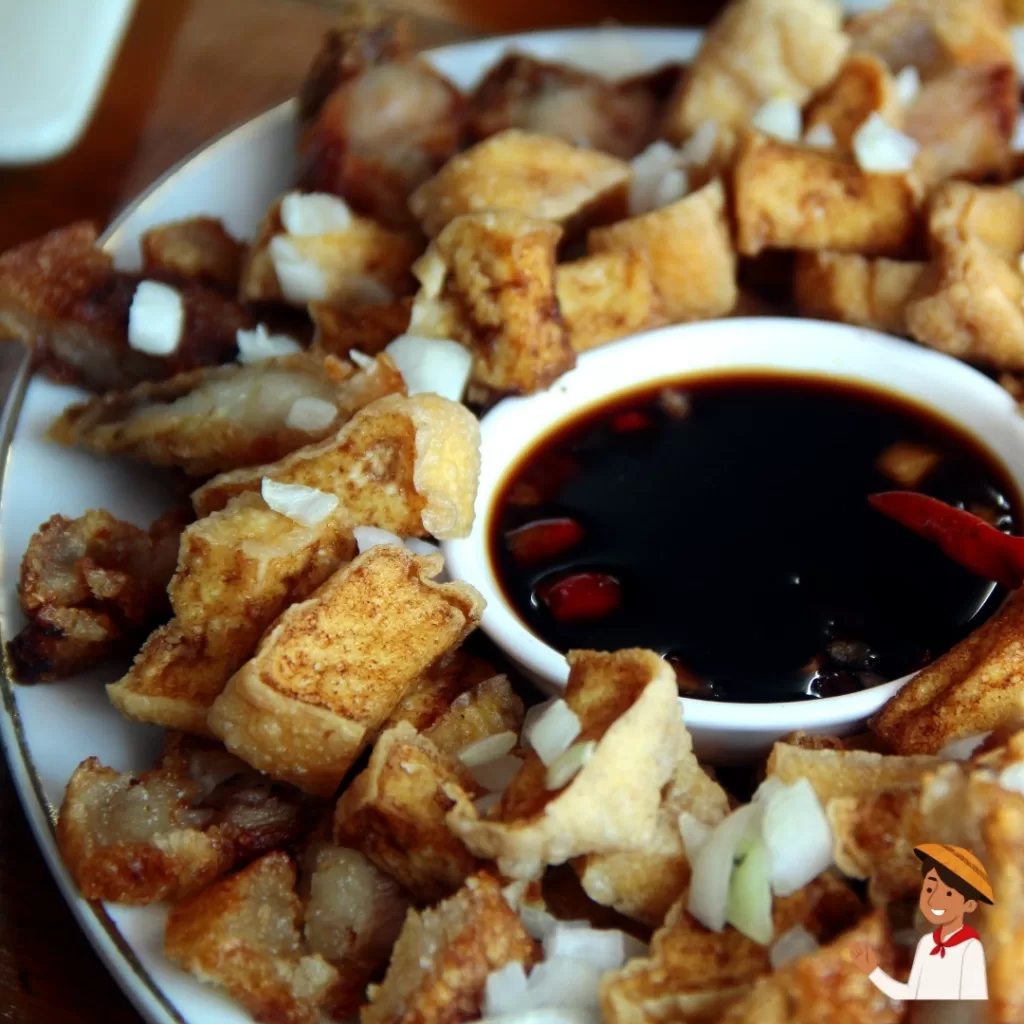 Crispy tokwat baboy with onions and soy-vinegar dipping sauce.